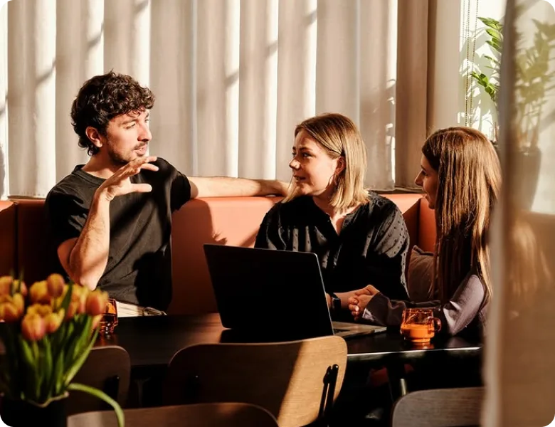 ChatCrafter team collaborating over a laptop
